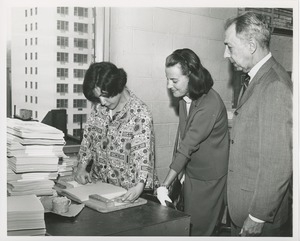 Mr. and Mrs. Charles Spalding observing a client at work