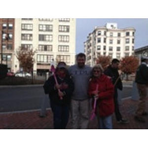 Volunteers pose with shovels in Kenmore Square