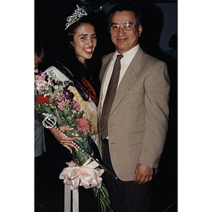 Yaritza Gonzalez, Miss Festival Puertorriqueño 1996, stands with a man