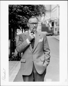 Suffolk University President Thomas A. Fulham (1970-1980), outdoors smoking a pipe