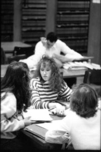 Suffolk University students studying in the library
