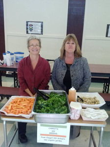 Serving garden produce in school cafeteria