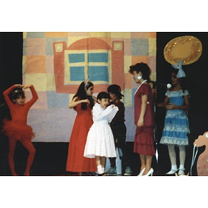 Children in an Areyto program performing in a play on stage at the Jorge Hernandez Cultural Center.