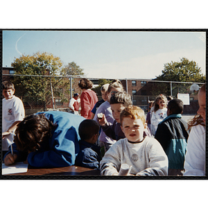 Children congregate at a carnival