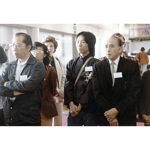 You King Yee and other members of the Chinese Progressive Association await the arrival of a Chinese diplomat at the airport in Boston