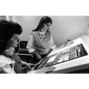 Co-op students working on newspaper layout