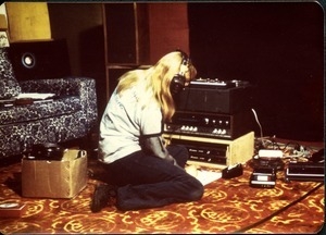 Heidi Bushell in headphones with audio equipment in the video studio in the Block basement