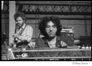 Jerry Garcia playing pedal steel and David Nelson (New Riders of the Purple Sage) performing on stage at Dupont Gym, MIT