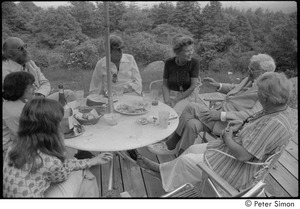 Ram Dass and dad at mum's: Ram Dass, Phyllis Alpert, Andrea Simon, George Alpert, unidentified, Ronni Simon, and unidentified, clockwise from top left, seated on a patio