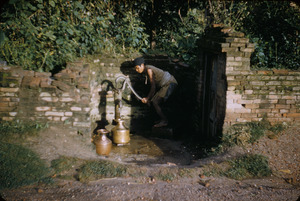 Man pumping water