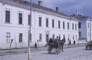 Horse-drawn cart moves down Aranđjelovac street