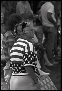 Older woman in American flag sweater watching the Chesterfield's Fourth of July parade