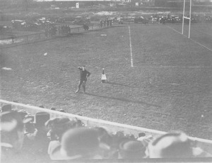 Cheer leader performing on Athletic football field