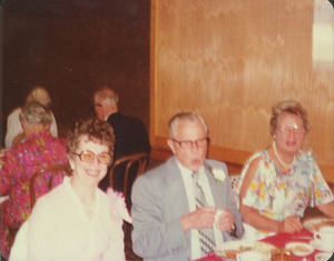 Theodore Farwell with two women companions at reunion dinner