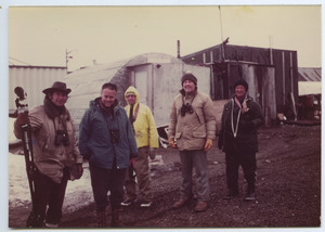 Birders outside a quonset hut