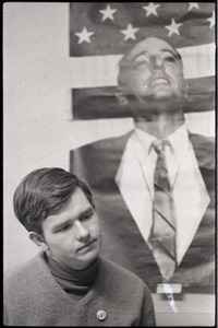 Young Americans for Freedom (YAF) office: YAF member in front of poster of William F. Buckley