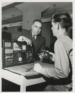 An instructor works with a trainee at TOWER lock assembly evaluation