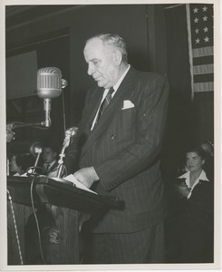 Unidentified man at podium at Institute Day