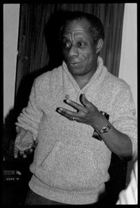 James Baldwin: informal portrait, gesturing, at the book party for Robert H. Abel
