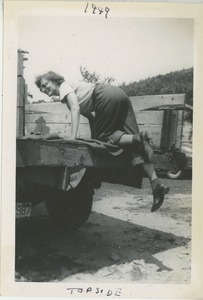 Bernice Kahn climbing into the back of a truck