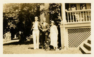Leon M. Smith standing along porch