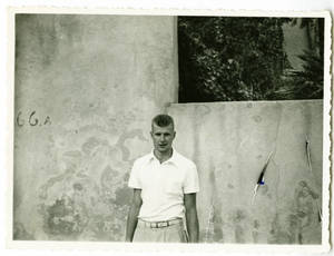 Joseph Lyles in front of stucco wall during the Harlem Globetrotters 1952 World Tour