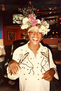 A Photograph of Marsha P. Johnson Wearing a Shirt With Embroidered Sombreros