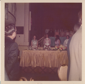Maria de Lourdes Serpa standing at table, on left