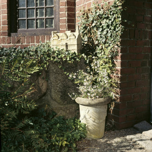 Exterior view of stone house model and Arts and Crafts planter, Beauport, Sleeper-McCann House, Gloucester, Mass.