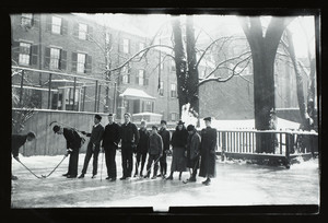 Group of young adults playing ice polo outdoors, 28 Mt. Vernon St., Boston, Mass.