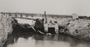 View of a damaged small bridge spanning the Yser [IJzer] river, Furnes, Belgium