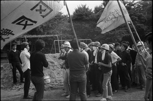 Protesters debating tactics and strategy in anti-Vietnam war demonstration