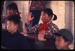 Hsiao Ying Primary School -- four children, girl waving hand
