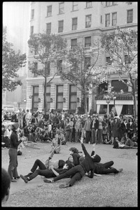 Street theater at the Vietnam Moratorium in New York: mimes in a pile after a gun fight