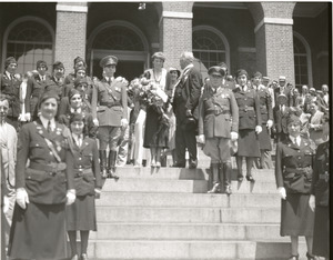 Amelia Earhart reception: Earhart, with bouquet of flowers, atop the steps of the Massachusetts State House
