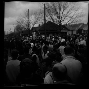 Marchers in the streets of Montgomery, gathered in front of the Stop-n-Shop store