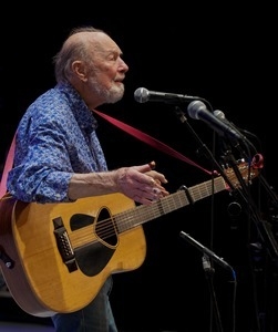 Pete Seeger on stage on his guitar at the Power of Song Award concert, Symphony Space, New York City