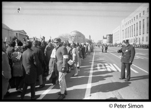 Protesters lined up along Pennsylvania Avenue, with police keeping order: Vietnam Moratorium march on Washington