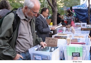 Occupy Wall Street: man browsing books in the People's Free Library