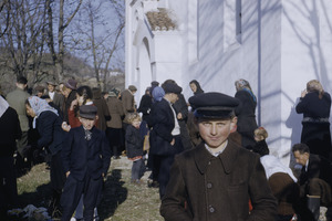 Boy outside village church