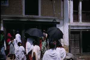Women crowding doorway of shop
