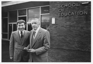 Mario D. Fantini standing outdoors with man, outside of School of Education