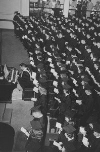 Graduates sing along with an organist during baccalaureate services