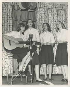 Girls singing and playing guitar