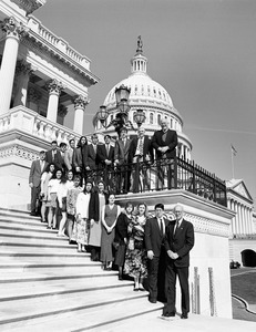 Congressman John W. Olver (right) with group of visitors, posed on the steps of the United States Capitol building