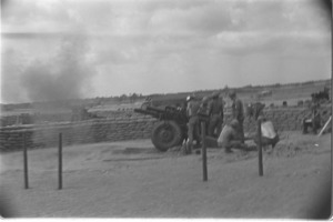 Artillerymen firing 105mm howitzers against targets in delta.