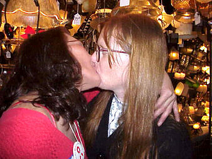 A Photograph of Sylvia Rivera Kissing Her Partner Julia Murray at Uplift Lighting