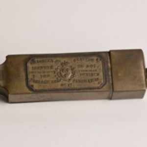 Brass container of thirty-eight stamped brass seals