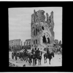 Horses drawing carriage in front of ruined cathedral