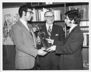 Suffolk University President Thomas A. Fulham (1970-1980) congratulates the winners of the 1973 Jessup Moot Court competition regionals, Allen Shirlman and Kenneth Sherman